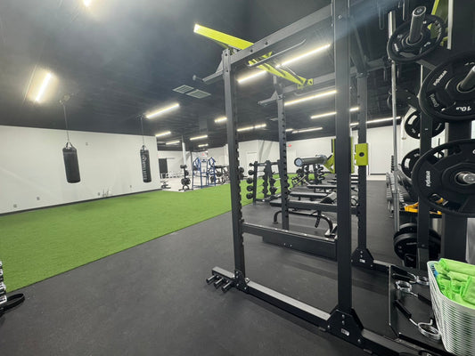 Powerhouse Gym Las Vegas new functional training area with turf, power rack, and heavy bags