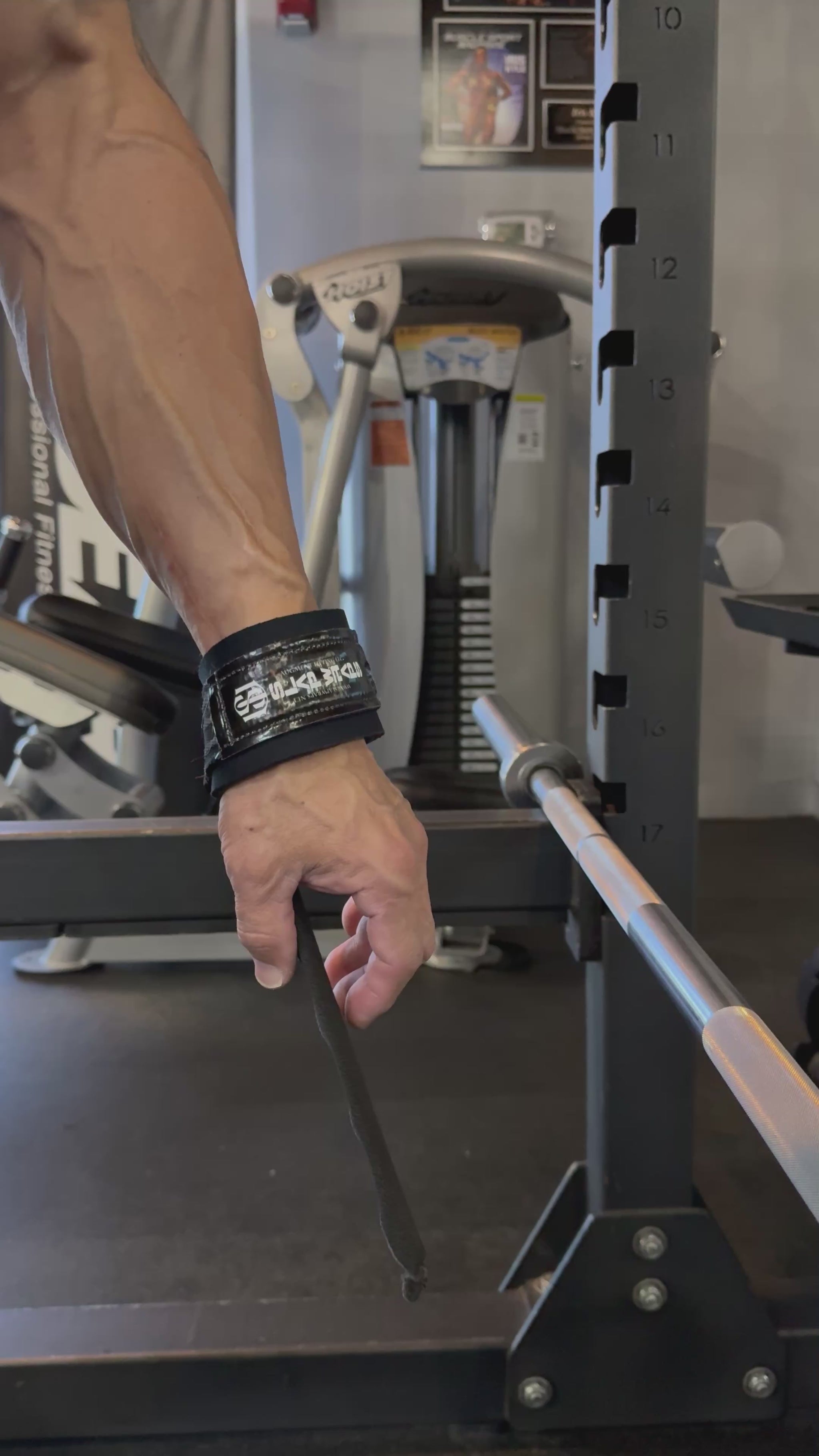 Slap Wraps V2 auto-wrapping onto a barbell in one motion
